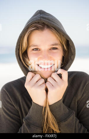 Pretty blonde woman relaxing in hoodie Stock Photo