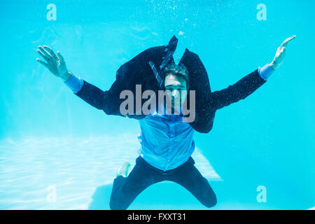 Dressed businessman in swimming pool Stock Photo