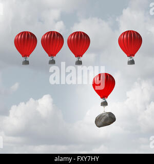 Competitive struggle and business disadvantage or disability concept as a group of hot air balloons racing to the top but an individual laggard attached to a heavy rock boulder struggling to compete as a 3D illustration. Stock Photo