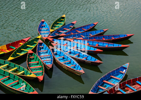 Colorful small boats on Phewa Lake in Pokhara, Nepal Stock Photo