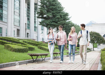 Domestic students and international students walking on campus Stock Photo