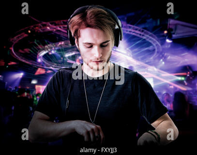 View on young bearded man playing music in nightclub Stock Photo