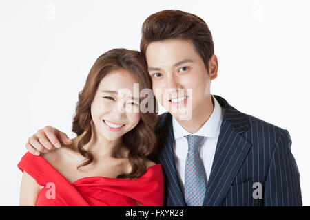 Portrait of young smiling couple staring at front Stock Photo