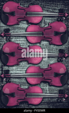 Violin on grey wooden background. With space for text writing. Stock Photo