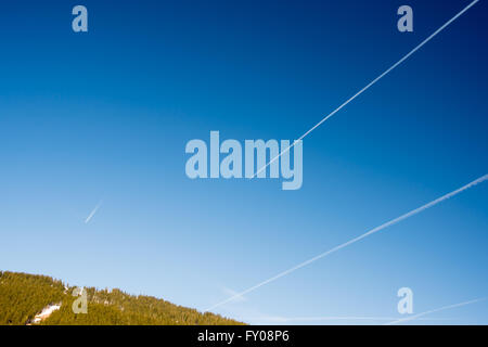 fantastic Blue sky with clouds and traces of planes Stock Photo