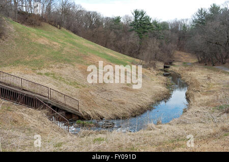 battle creek regional park scenic with hillside and stream flowing through spillway along trail Stock Photo