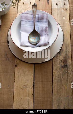 empty soup bowl with spoon on old wooden background Stock Photo