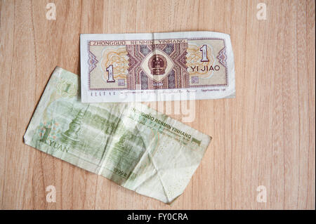 Renminbi Yuan and Jiao reverse banknotes, Chinese RMB or CNY and Mao or Hou currency in China, paper cash money lying on table Stock Photo