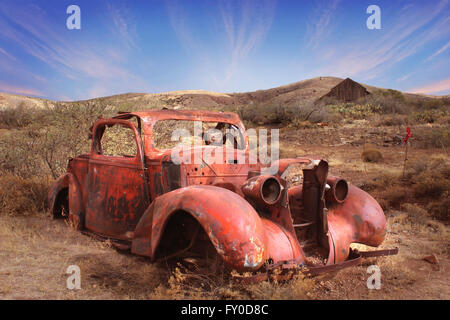 Old metal body of car from 1930's rusting in Arizona Desert between Phoenix and Prescott Stock Photo