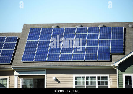 solar panel installed on the roof of apartment building Stock Photo