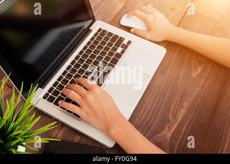 close up hand using laptop working in office Stock Photo