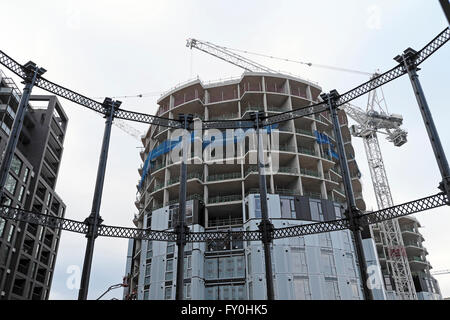 Gas holder residential tower under construction at Pancras Lock canalside in Kings Cross  London UK  KATHY DEWITT Stock Photo