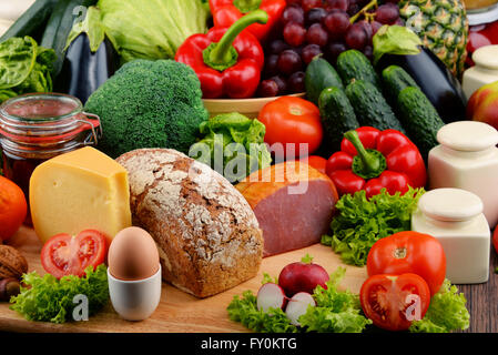 Variety of organic food including vegetables fruit bread dairy and meat. Balanced diet. Stock Photo