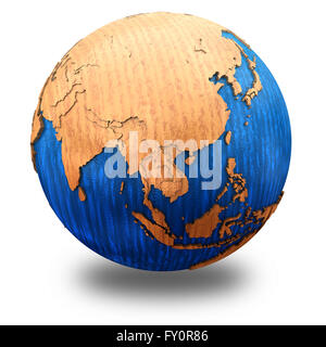 Southeast Asia on wooden model of planet Earth with embossed continents ...