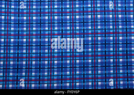 Closeup of colorful square patterns and textures on blue fabric background Stock Photo