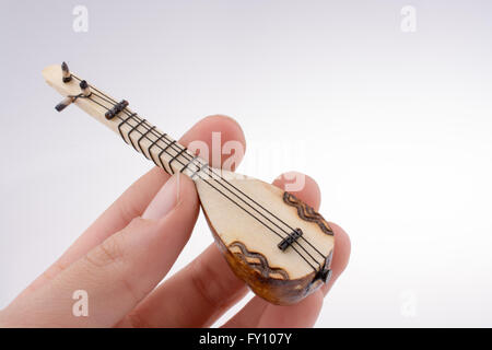 Hand holding the classic turkish instrument Saz Stock Photo