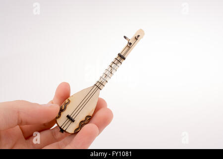 Hand holding the classic turkish instrument Saz Stock Photo