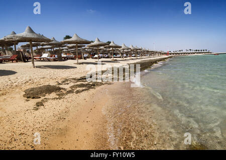Marsa Alam beach with row of umbrella, Egypt Stock Photo