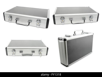 four metallic suitcase isolated on white background. Stock Photo
