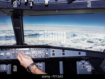 Cropped image of pilot in airplane cockpit Stock Photo