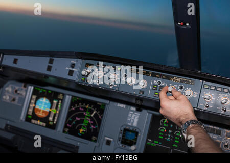 Cropped image of pilot in airplane cockpit Stock Photo