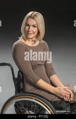 Portrait of confident woman sitting in wheelchair Stock Photo