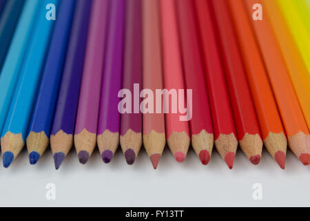 color pencils on white background - row of crayons Stock Photo