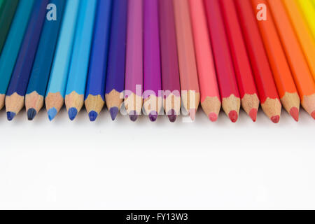 color crayons on white background - row of pencils Stock Photo