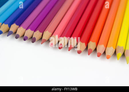 color pencils on white background - row of crayons Stock Photo