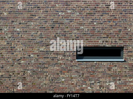 Brick texture with different colors and styles and a window. Stock Photo