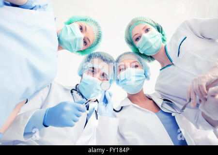group of doctors in operating room Stock Photo