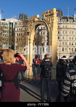 London, UK. 19th April, 2016. Crowds photographing and enjoying a recreation of the Arch of Triumph from Syria's ancient city of Palmyra.  The arch has been recreated by 3D printing and will travel the world. Credit:  Amanda Lewis/Alamy Live News Stock Photo