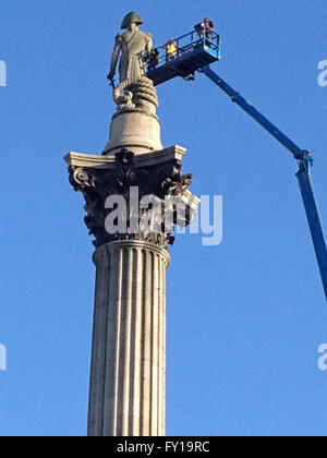 London, UK. 19th April, 2016. Engineers using a tall cherry picker inspect the statue of Lord Nelson on top of the tall column in Trafalgar Square, London.  The day before, the landmark had been scaled by Greenpeace activists who placed a mask on the statue. Credit:  Amanda Lewis/Alamy Live News Stock Photo