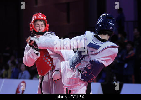 Pasay City, Philippines. 20th Apr, 2016. Shao Fenfen of China (R) competes against Dinorahon Mamadibragimova of Uzbekistan during their quarterfinals match in women's -57kg category in the 22nd Asian Taekwondo Championships in Pasay City, the Philippines, April 20, 2016. Shao won, 4-1. © Rouelle Umali/Xinhua/Alamy Live News Stock Photo