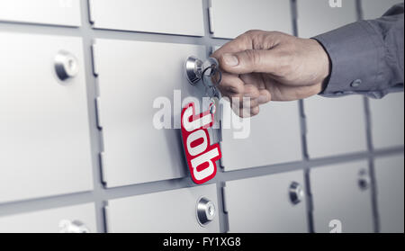 Man hand about to turn a key with the word job. Many closed doors at the background. Concept image for illustration of career op Stock Photo