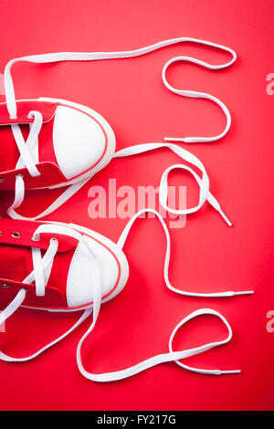 White shoe lace on red sneakers Stock Photo