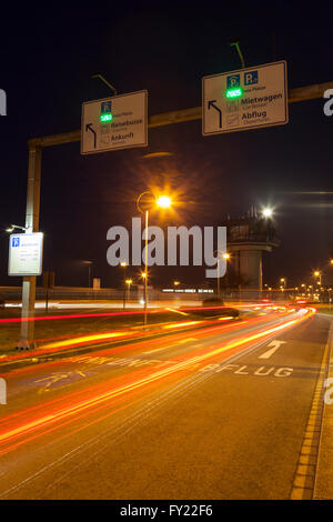 Light trails on the access road to Dortmund Airport 21, Dortmund, Ruhr Area, North Rhine-Westphalia, Germany Stock Photo