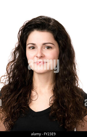 Portrait of a young confident businesswoman with dark curled hair. Stock Photo