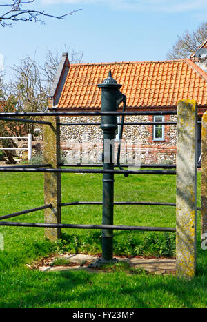 An old village water pump on the village green at North Creake, Norfolk, England, United Kingdom. Stock Photo