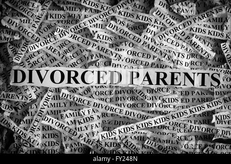 Torn pieces of paper with the words Divorced parents. Concept Image. Black and White. Closeup. Stock Photo