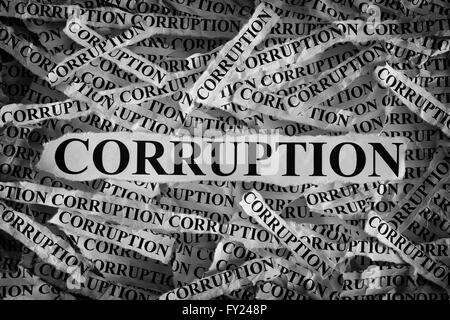 Torn pieces of paper with the word Corruption. Concept Image. Black and White. Closeup. Stock Photo