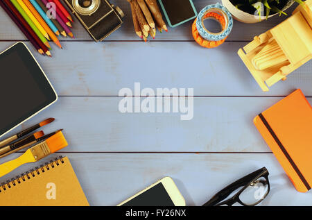 top view photo of business and school supplies on wooden table. vintage filtered Stock Photo