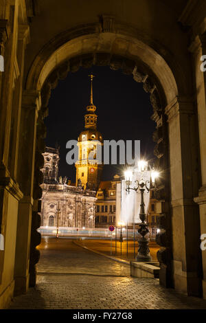 View of the Hofkirche with the city lights in the foreground at night time, Dresden Stock Photo