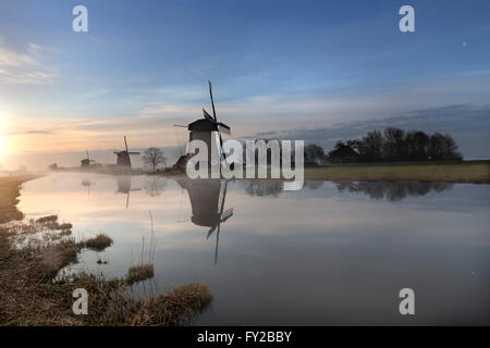 Beautiful sunrise in the Netherlands by the old dutch windmills Stock Photo