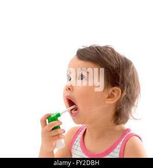 Little sick girl used medical spray for breath Stock Photo