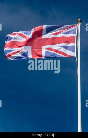 British national flag against blue sky Stock Photo - Alamy