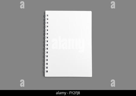 Blank spiral notebook isolated on gray background Stock Photo
