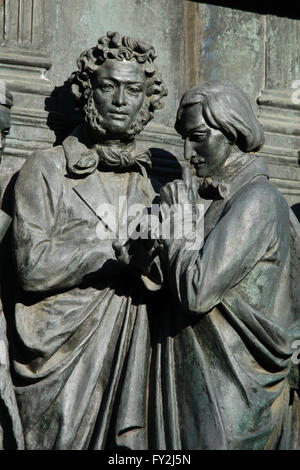 Russian poet and writer Alexander Pushkin (L) and Russian novelist and writer Nikolai Gogol (R) depicted in the bas relief dedicated to Russian writers and artists by Russian sculptor Ivan Schroder. Detail of the Monument to the Millennium of Russia (1862) designed by Mikhail Mikeshin in Veliky Novgorod, Russia. Stock Photo