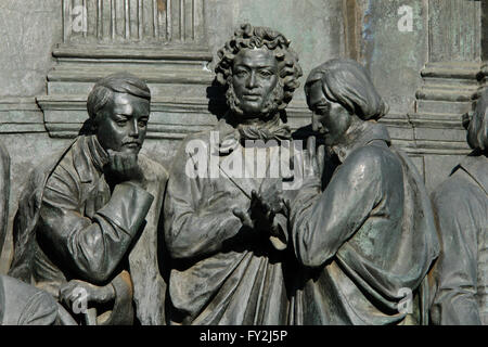 Russian poet and writer Mikhail Lermontov, Russian poet and writer Alexander Pushkin and Russian novelist and writer Nikolai Gogol depicted (from left to right) in the bas relief dedicated to Russian writers and artists by Russian sculptor Ivan Schroder. Detail of the Monument to the Millennium of Russia (1862) designed by Mikhail Mikeshin in Veliky Novgorod, Russia. Stock Photo