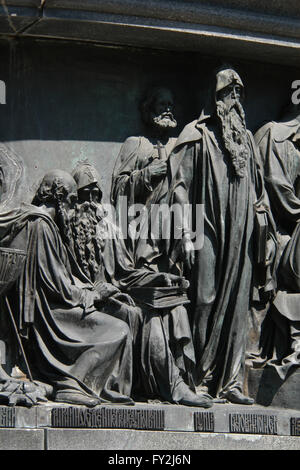 Saints Anthony and Theodosius of Kiev, the founders of the Kiev Pechersk Lavra, Saint Kuksha of the Kiev Caves and Saint Nestor the Chronicler depicted (from left to right) in the bas relief dedicated to Russian men of enlightenment by Russian sculptor Matvey Chizhov. Detail of the Monument to the Millennium of Russia (1862) designed by Mikhail Mikeshin in Veliky Novgorod, Russia. Stock Photo